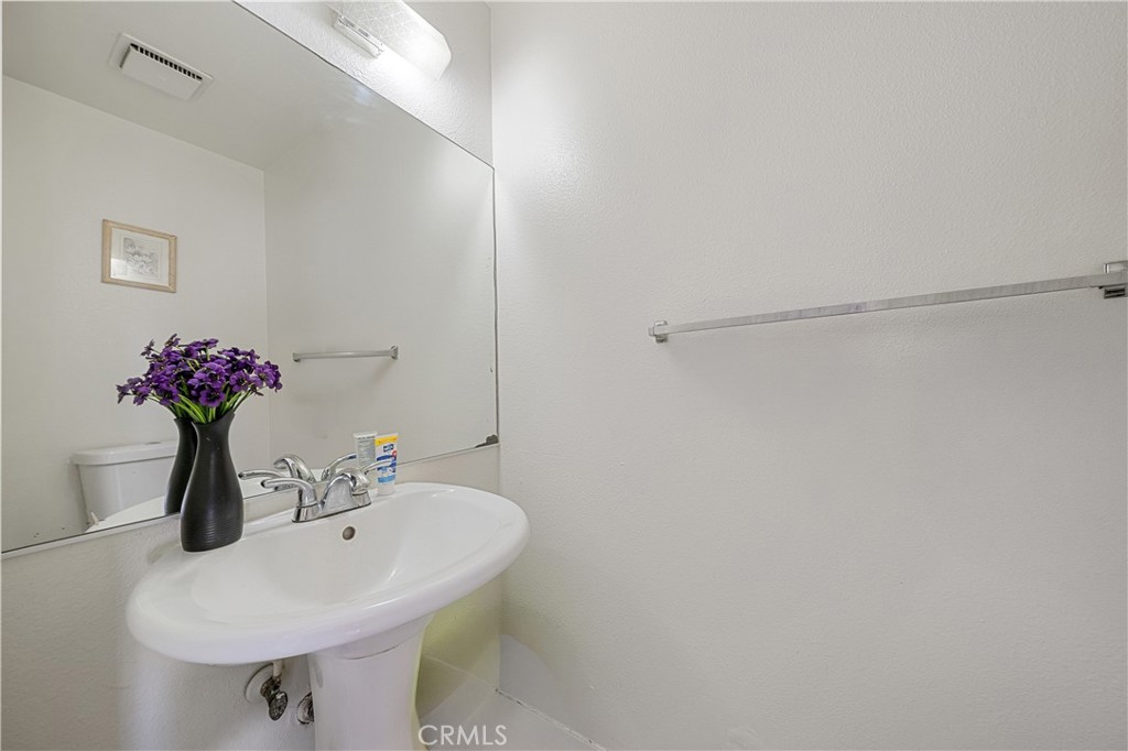 9471 Cortada Street El Monte, CA 91733 - Photo 23 of 27 a bathroom with a sink and a mirror