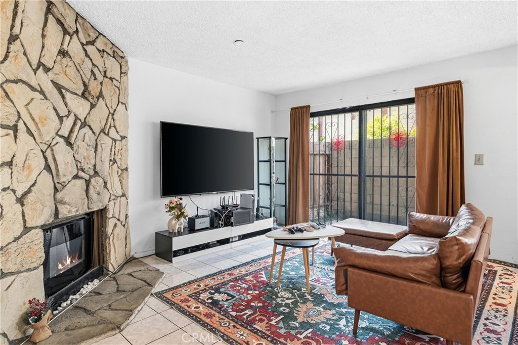 9471 Cortada Street El Monte, CA 91733 - Photo 5 of 27 a living room with furniture and a flat screen tv