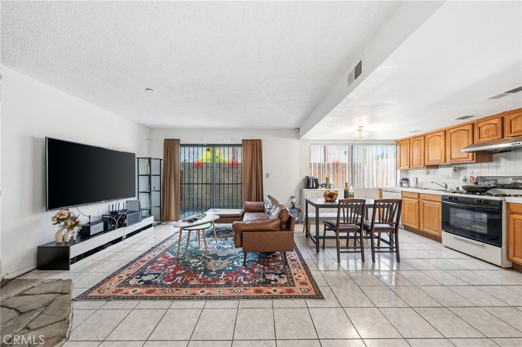 9471 Cortada Street El Monte, CA 91733 - Photo 10 of 27 a living room with furniture and a flat screen tv