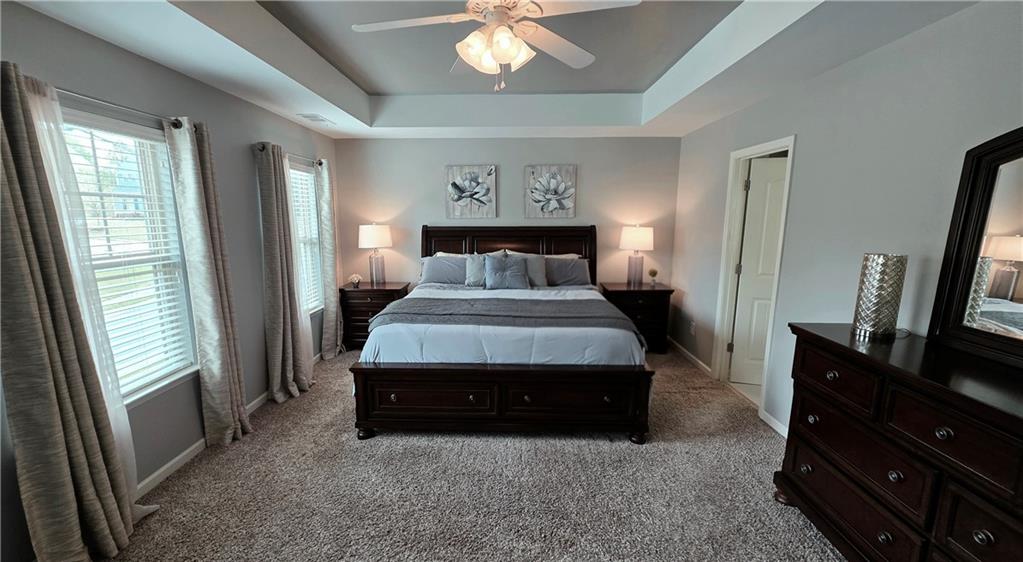 303 High Water Court Acworth, GA 30102 - Photo 11 of 27 a living room with furniture and a flat screen tv