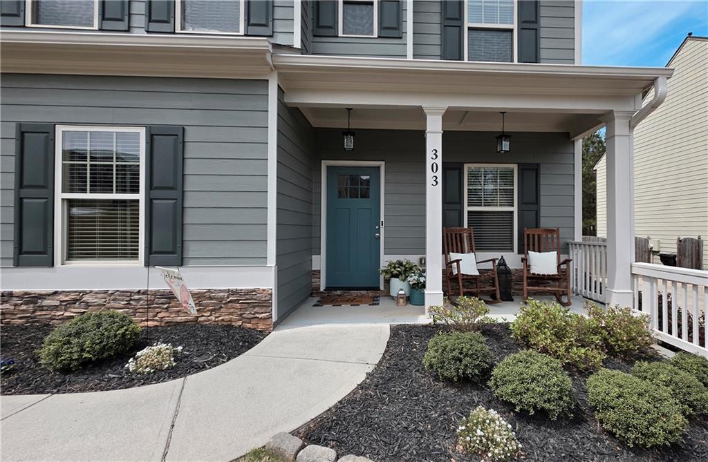 303 High Water Court Acworth, GA 30102 - Photo 2 of 27 a front view of a house with outdoor seating