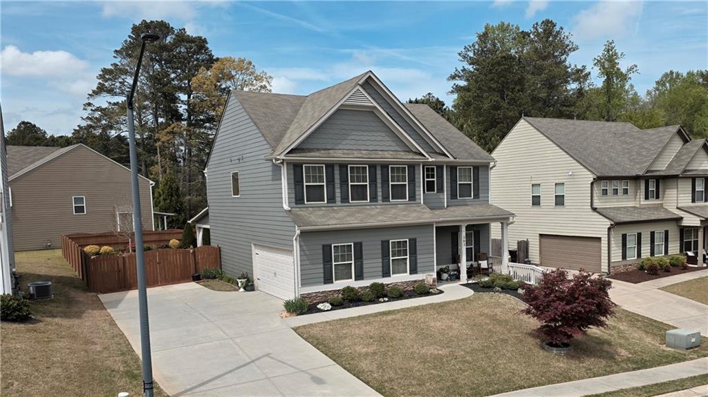303 High Water Court Acworth, GA 30102 - Photo 27 of 27 a front view of a house with yard and parking