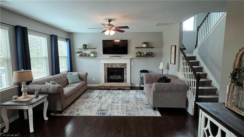 303 High Water Court Acworth, GA 30102 - Photo 8 of 27 a living room with furniture fireplace and flat screen tv