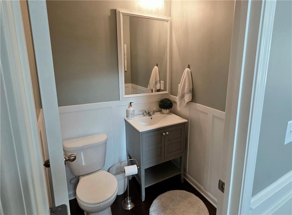 303 High Water Court Acworth, GA 30102 - Photo 9 of 27 a bathroom with a toilet sink and mirror