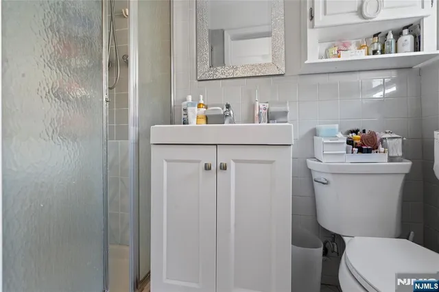 a bathroom with a toilet sink and vanity
