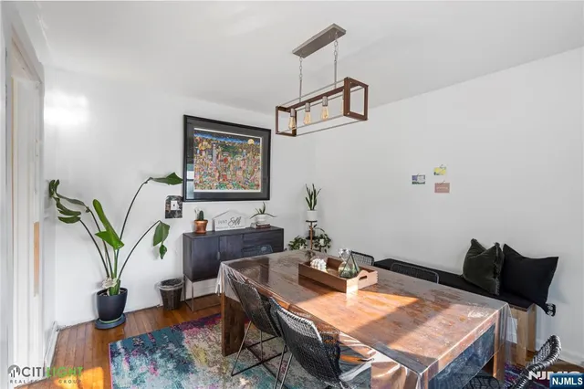 a reading room with furniture and wooden floor