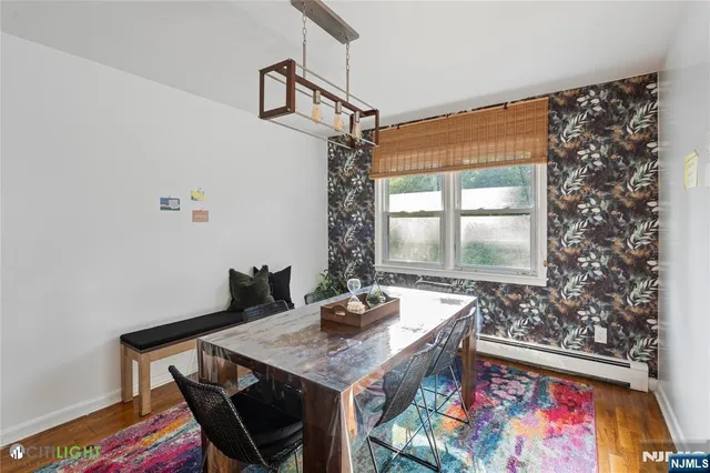 a dining room with a table and chairs