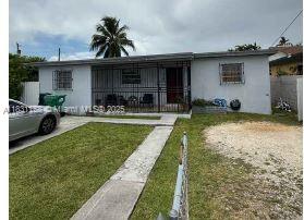 a view of a house with backyard sitting area and porch