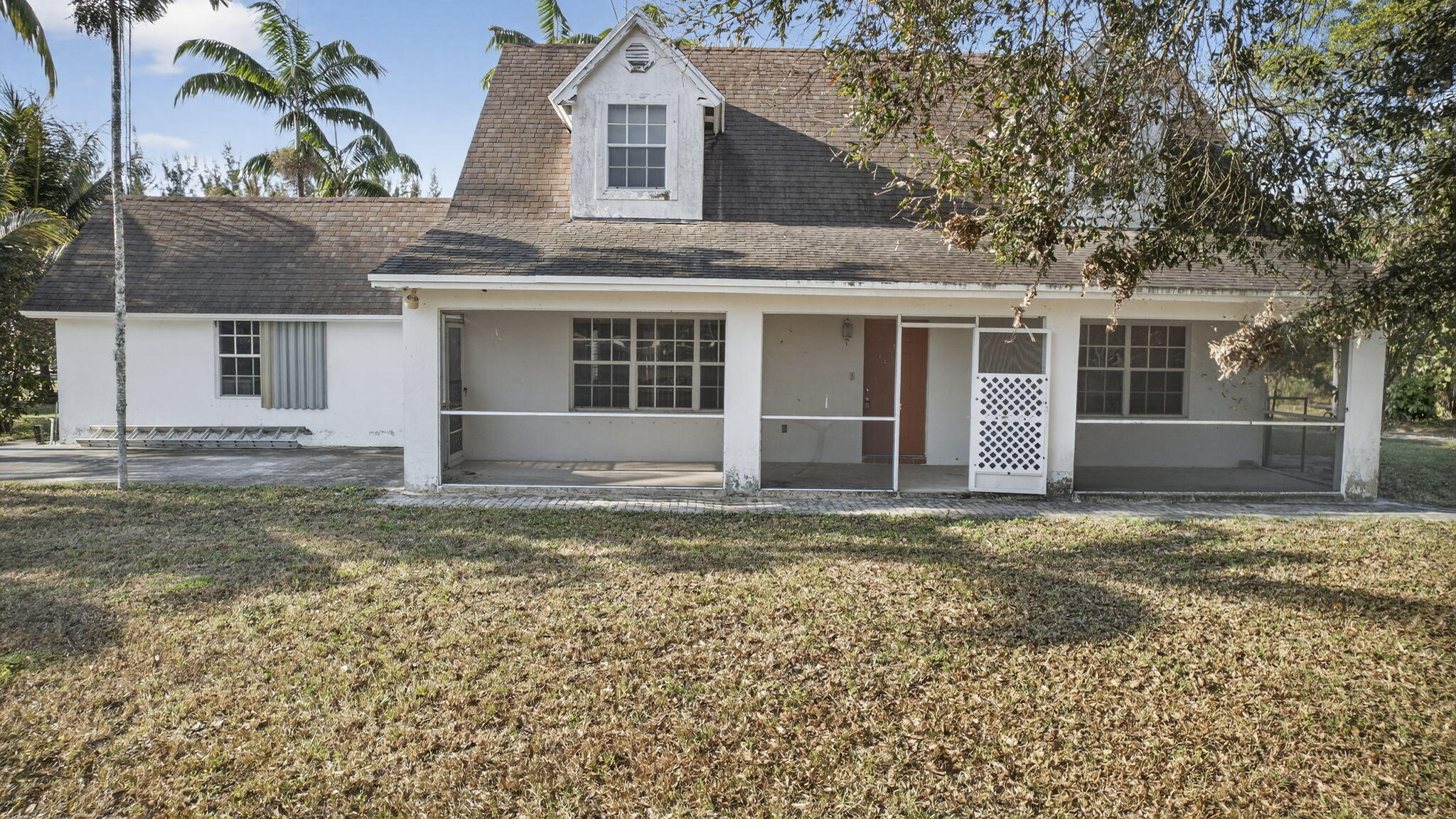 14685 40th Street North Loxahatchee Groves, FL 33470 - Photo 27 of 63 front view of a house with a yard