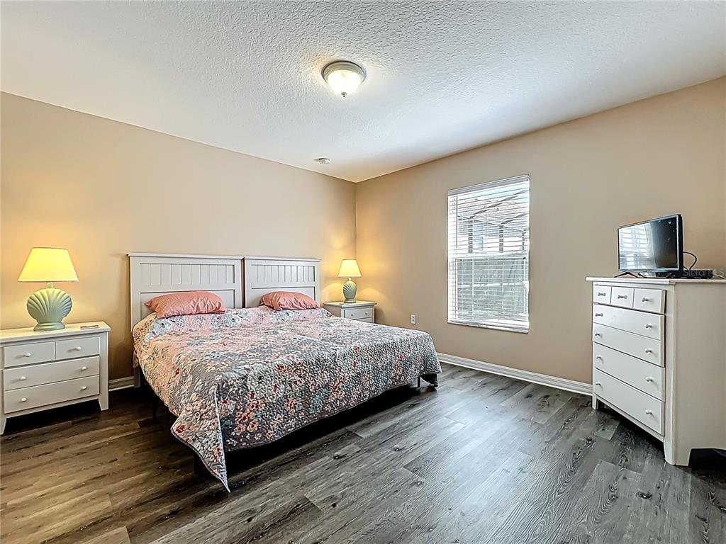 420 Robin Road Davenport, FL 33896 - Photo 15 of 29 a bedroom with a bed and a window