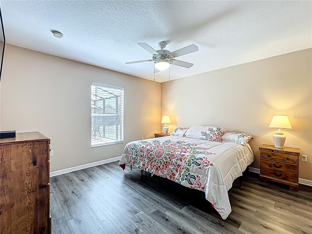 420 Robin Road Davenport, FL 33896 - Photo 19 of 29 a bedroom with a bed and window