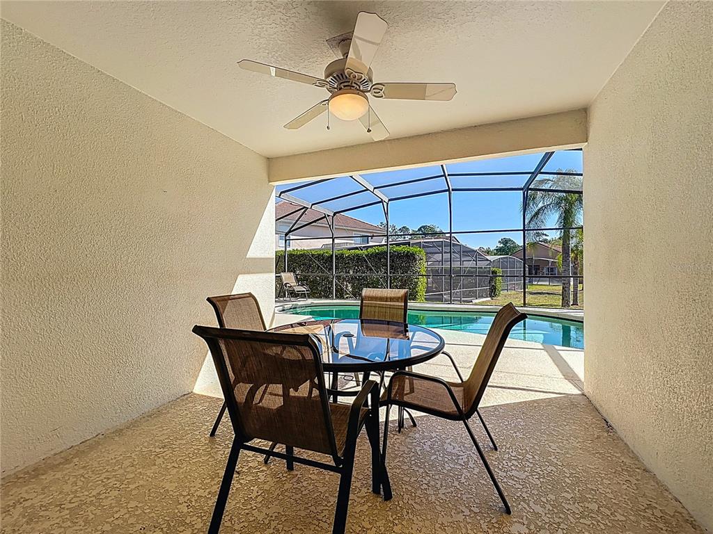 420 Robin Road Davenport, FL 33896 - Photo 26 of 29 a dining room with furniture and window