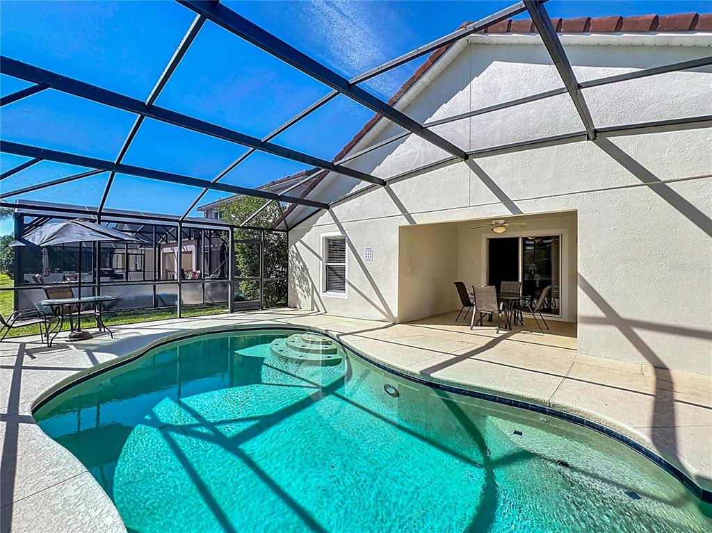 420 Robin Road Davenport, FL 33896 - Photo 27 of 29 a view of a house with pool and sitting area