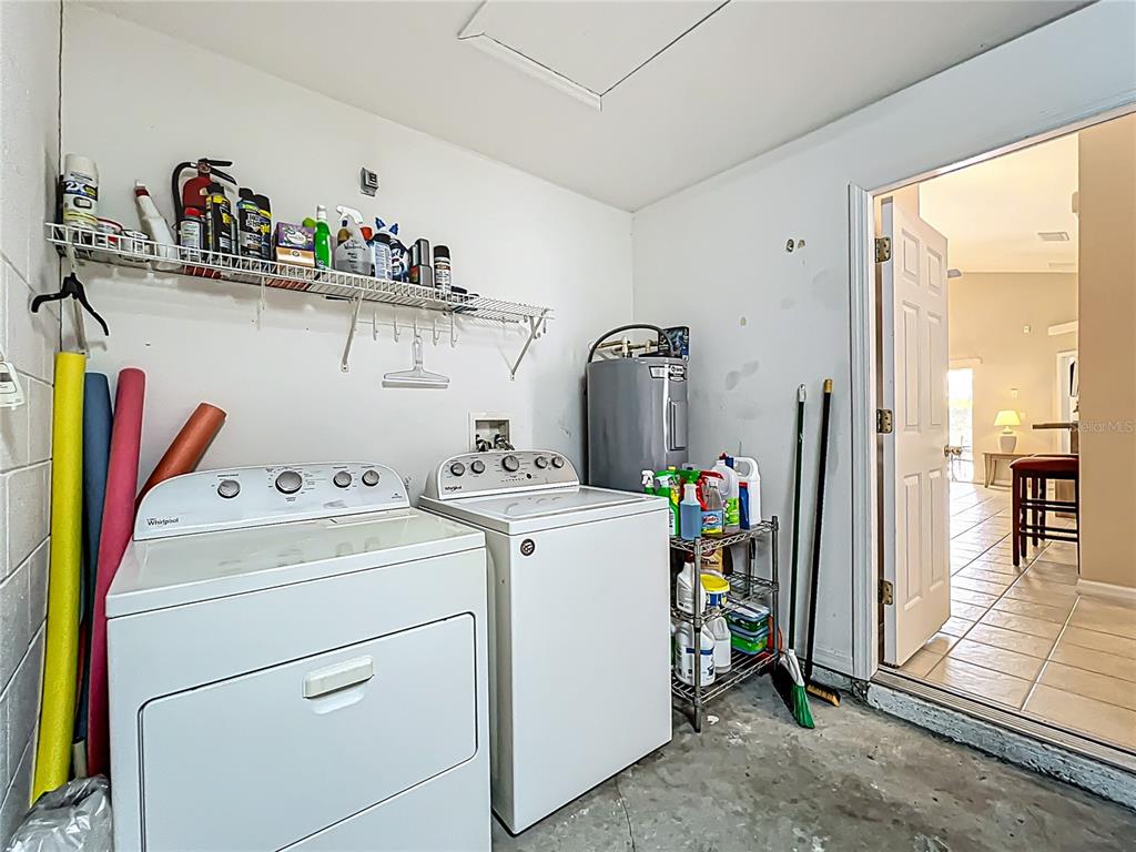 420 Robin Road Davenport, FL 33896 - Photo 29 of 29 a view of storage and utility room with washer and dryer