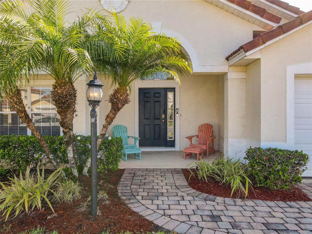 420 Robin Road Davenport, FL 33896 - Photo 3 of 29 a front view of a house with a yard