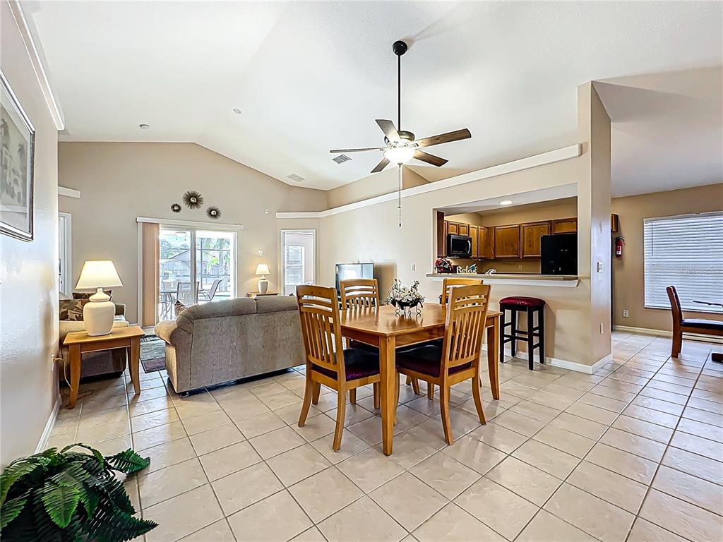 420 Robin Road Davenport, FL 33896 - Photo 7 of 29 a view of a dining room with furniture