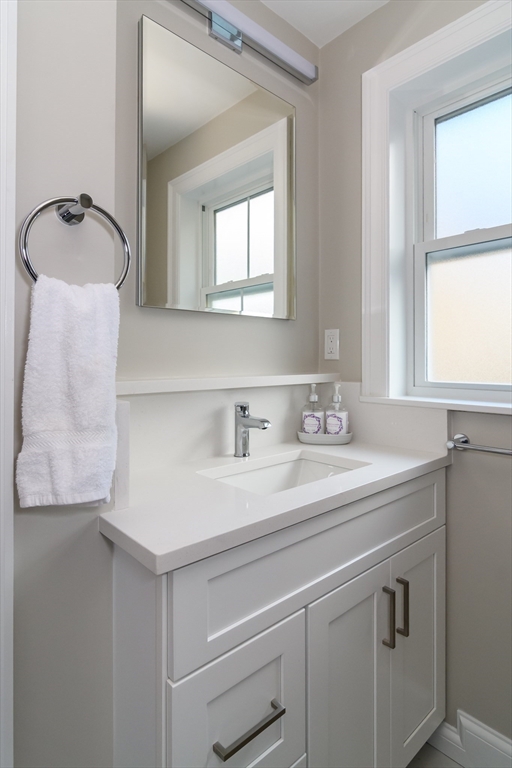 12 R Maugus Avenue, Unit 12R Wellesley, MA 02481 - Photo 12 of 19 a bathroom with a sink and a mirror