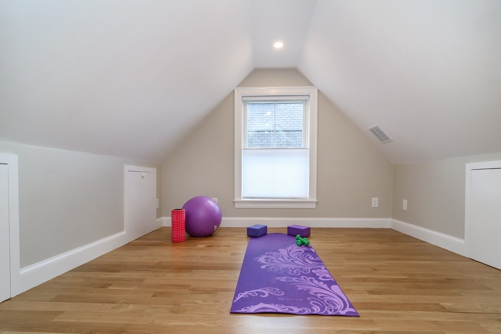 12 R Maugus Avenue, Unit 12R Wellesley, MA 02481 - Photo 15 of 19 an empty room with a rug and a window