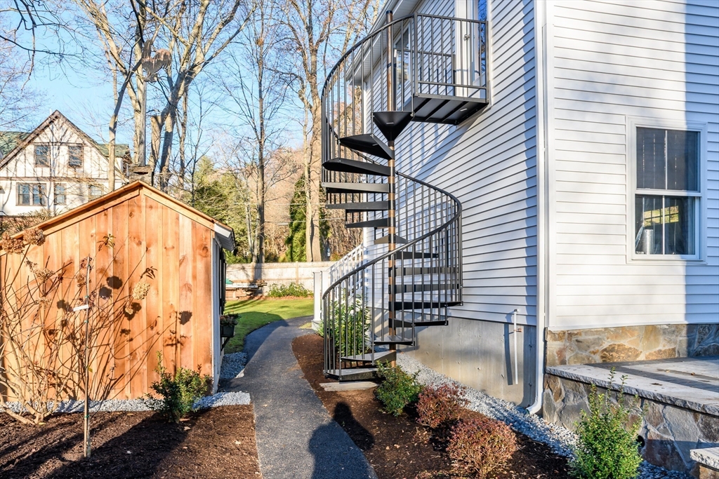 12 R Maugus Avenue, Unit 12R Wellesley, MA 02481 - Photo 18 of 19 a view of building with wooden stairs