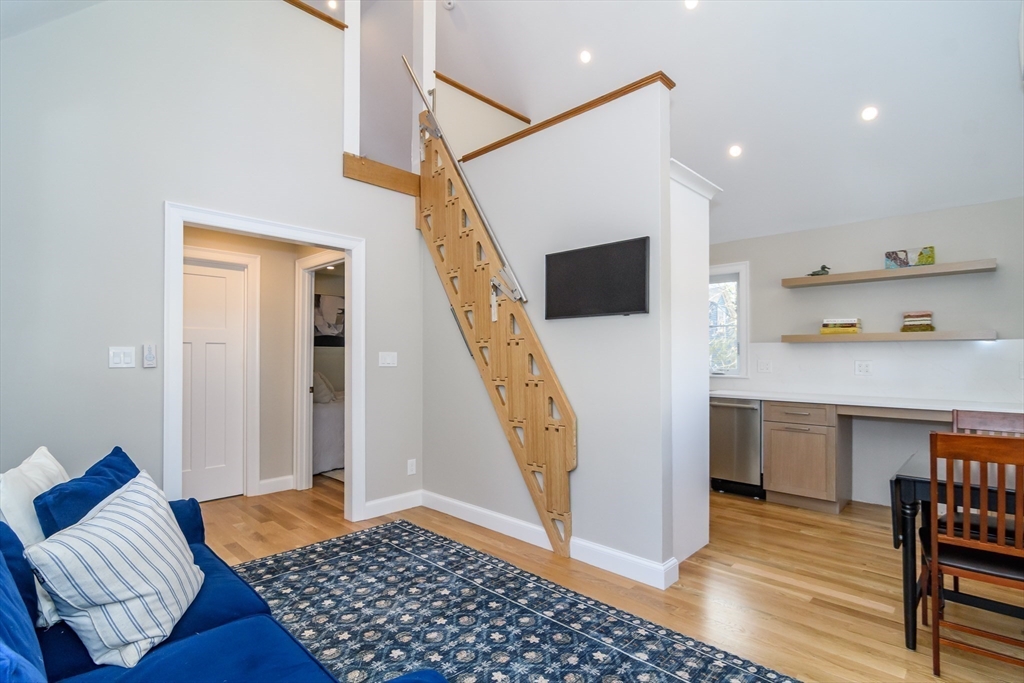 12 R Maugus Avenue, Unit 12R Wellesley, MA 02481 - Photo 2 of 19 a living room with furniture and a wooden floor
