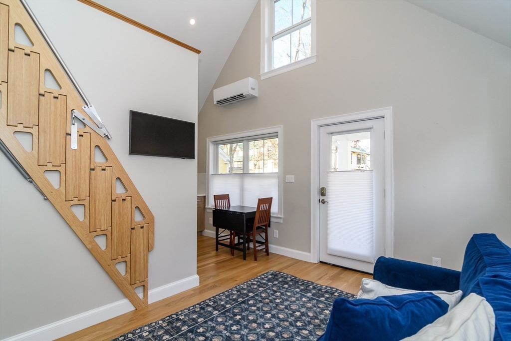 12 R Maugus Avenue, Unit 12R Wellesley, MA 02481 - Photo 3 of 19 a living room with furniture and a window