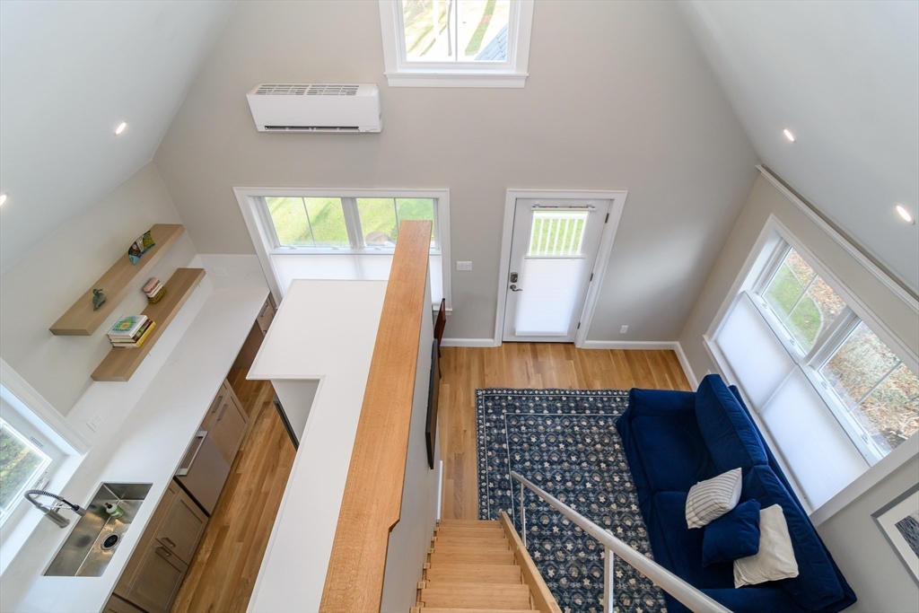 12 R Maugus Avenue, Unit 12R Wellesley, MA 02481 - Photo 4 of 19 a view of a living room with furniture and a window