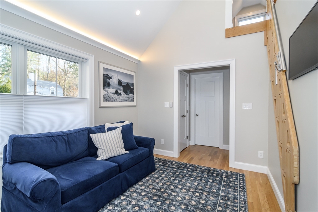 12 R Maugus Avenue, Unit 12R Wellesley, MA 02481 - Photo 7 of 19 a living room with furniture and a window