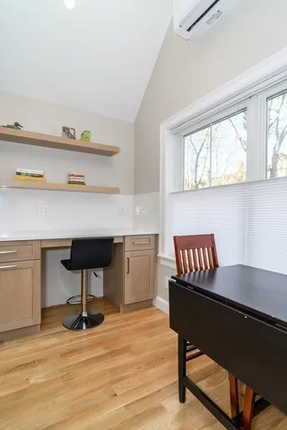 a room with furniture and a potted plant