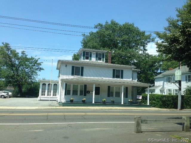 126 Derby Avenue Derby, CT 06418 - Photo 1 of 1 a front view of a building with a garden