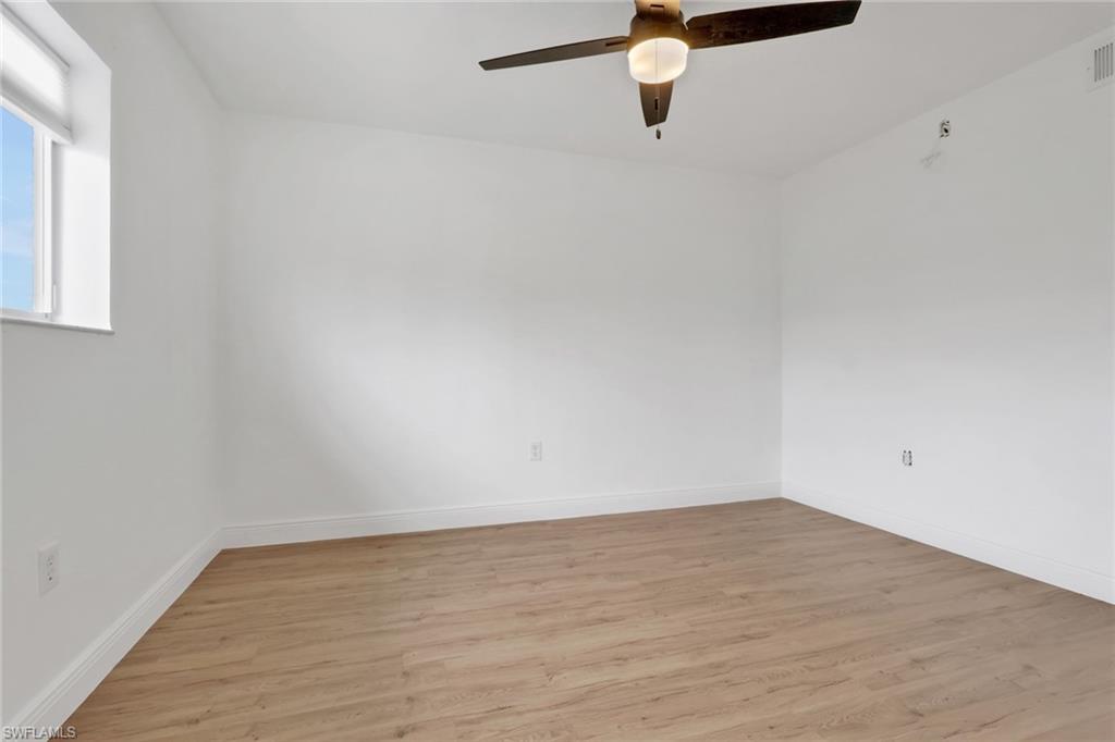 146 Cypress Way East, Unit 7 Naples, FL 34110 - Photo 21 of 27 a view of a room