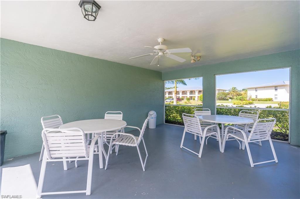 146 Cypress Way East, Unit 7 Naples, FL 34110 - Photo 27 of 27 a view of a dining room with furniture window and outside view