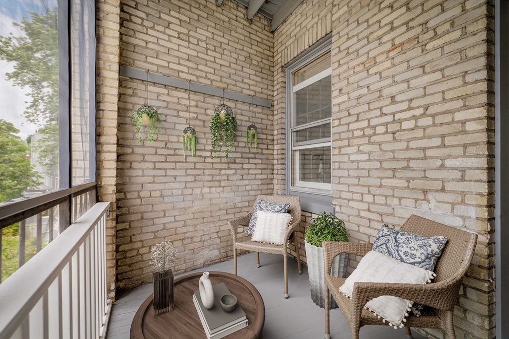 429 Washington Street, Unit 6 Brookline, MA 02446 - Photo 13 of 18 a view of a balcony with chairs