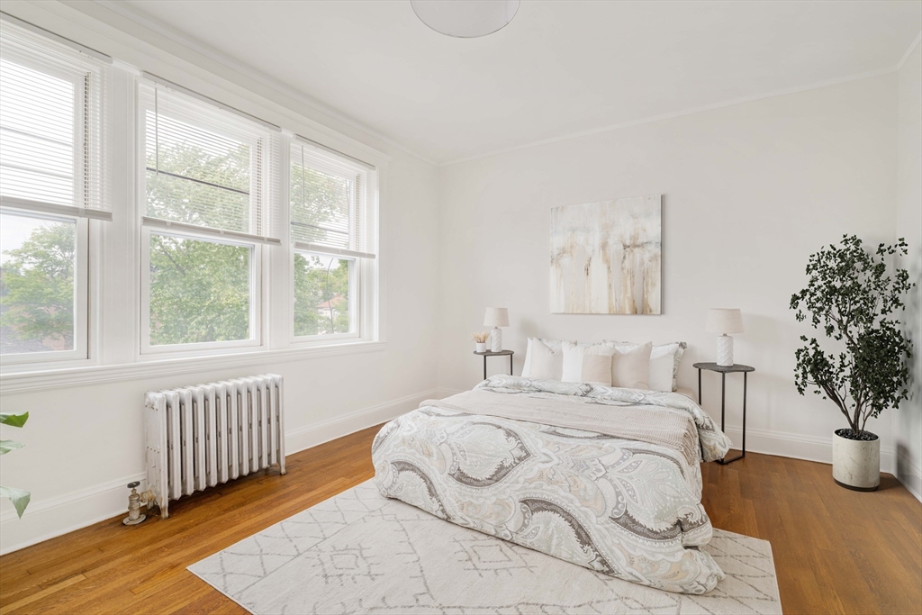 429 Washington Street, Unit 6 Brookline, MA 02446 - Photo 15 of 18 a bedroom with a large bed and a large window