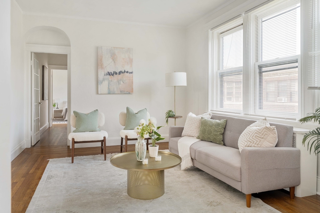429 Washington Street, Unit 6 Brookline, MA 02446 - Photo 3 of 18 a living room with furniture and a large window