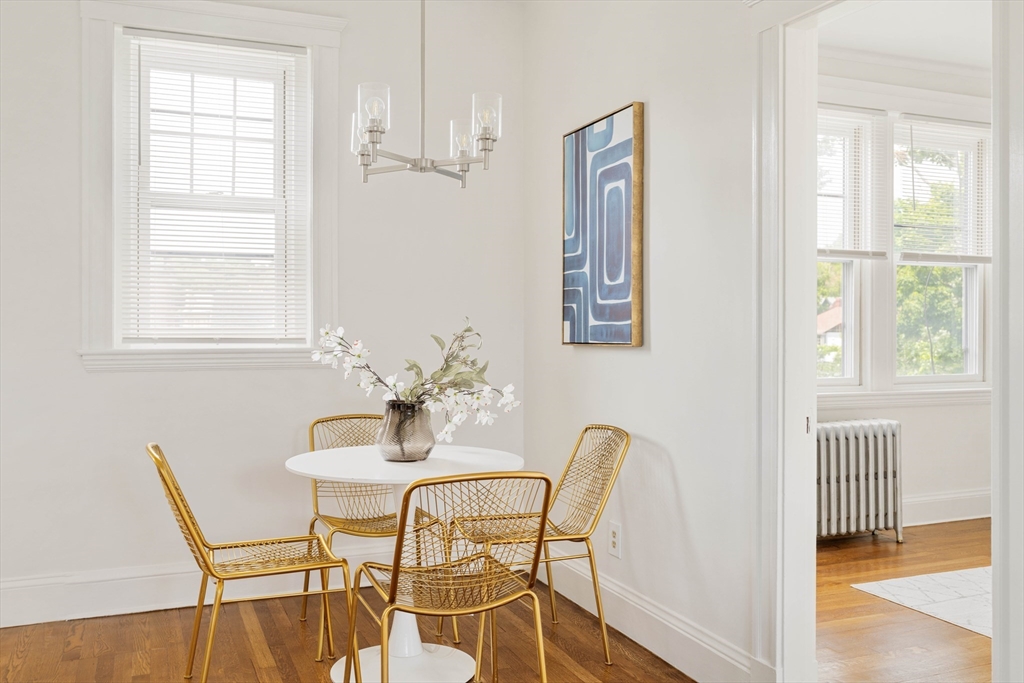 429 Washington Street, Unit 6 Brookline, MA 02446 - Photo 10 of 18 a view of a dining room with furniture and wooden floor