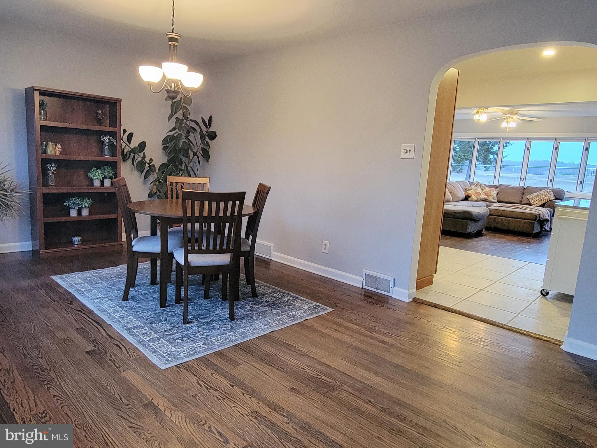 450 Tansboro Road Berlin, NJ 08009 - Photo 3 of 25 a view of a dining room with furniture and wooden floor