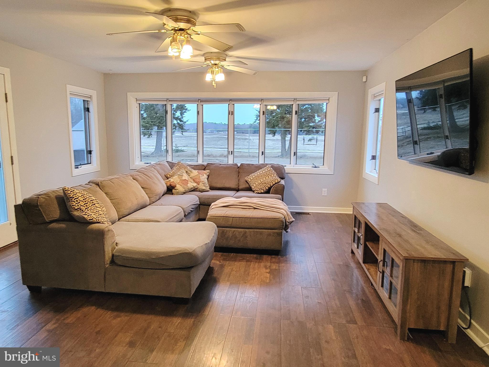 450 Tansboro Road Berlin, NJ 08009 - Photo 7 of 25 a living room with furniture and a flat screen tv