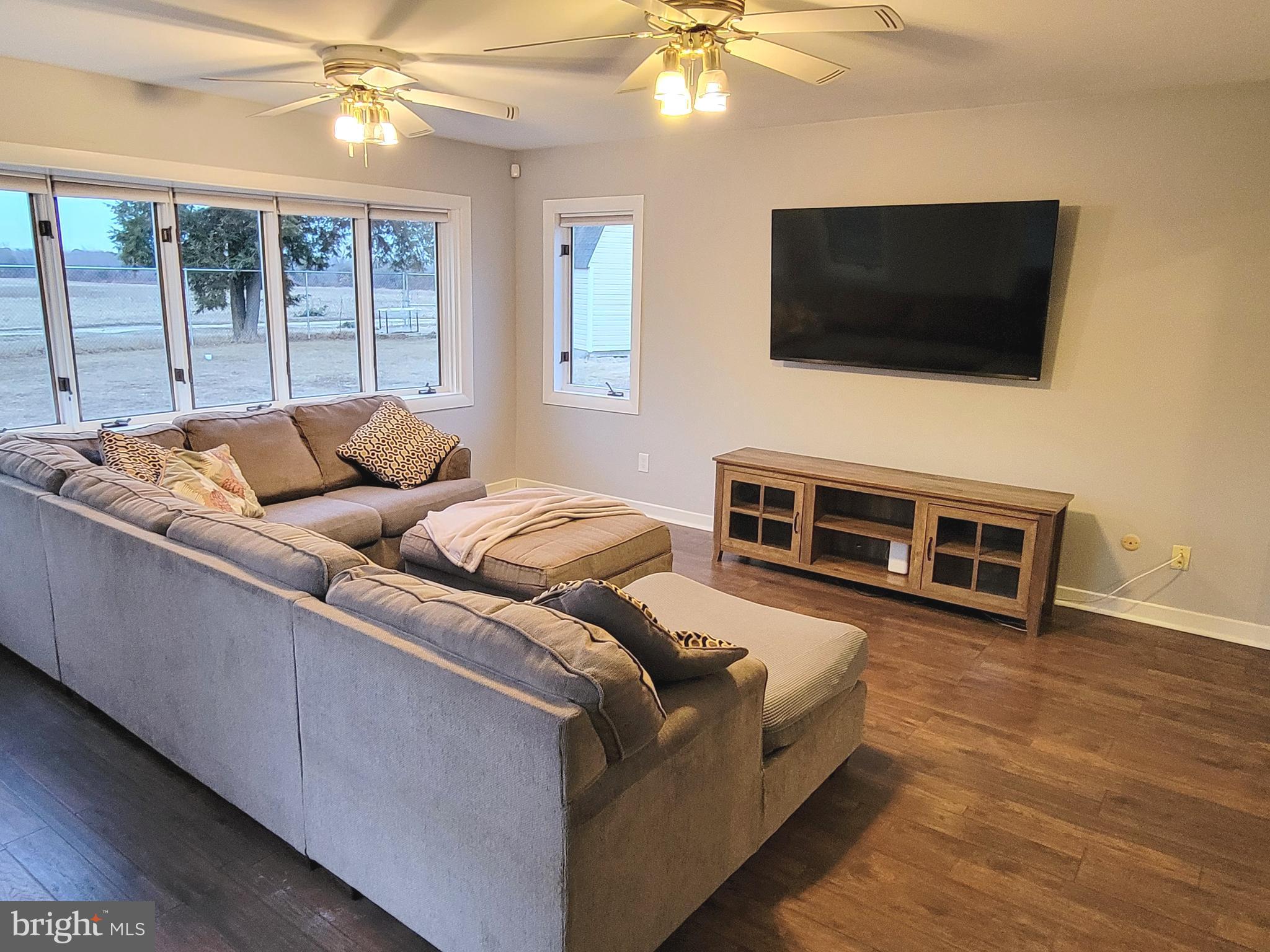 450 Tansboro Road Berlin, NJ 08009 - Photo 8 of 25 a living room with furniture and a flat screen tv