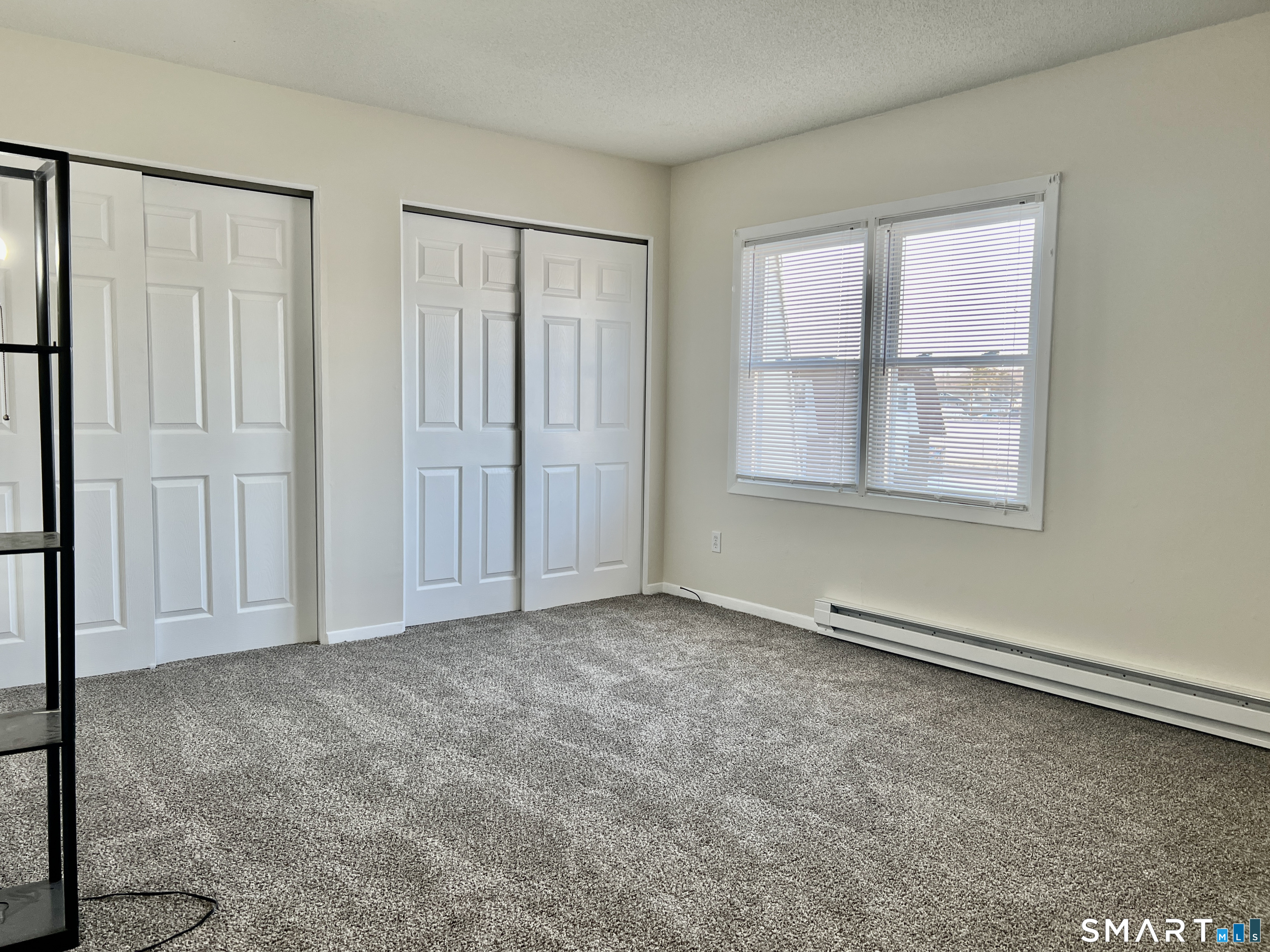8 Roma Street, Unit 8 East Haven, CT 06512 - Photo 12 of 26 an empty room with windows