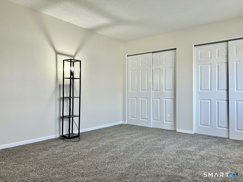 8 Roma Street, Unit 8 East Haven, CT 06512 - Photo 13 of 26 an empty room with windows