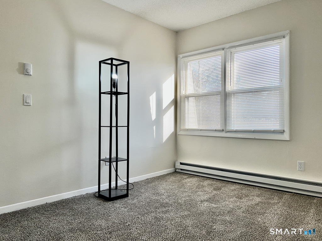 8 Roma Street, Unit 8 East Haven, CT 06512 - Photo 14 of 26 an empty room with windows