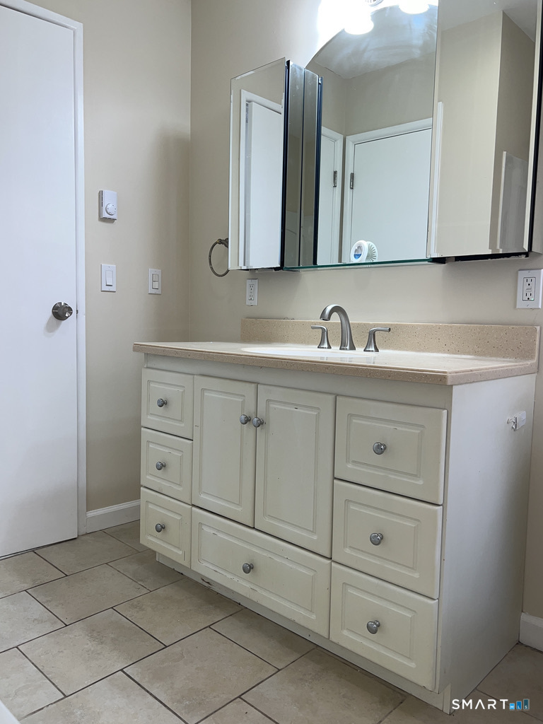 8 Roma Street, Unit 8 East Haven, CT 06512 - Photo 19 of 26 a bathroom with a sink and a mirror