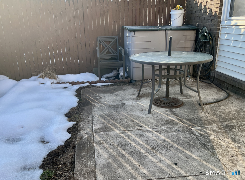 8 Roma Street, Unit 8 East Haven, CT 06512 - Photo 21 of 26 a view of a room with a table and chairs