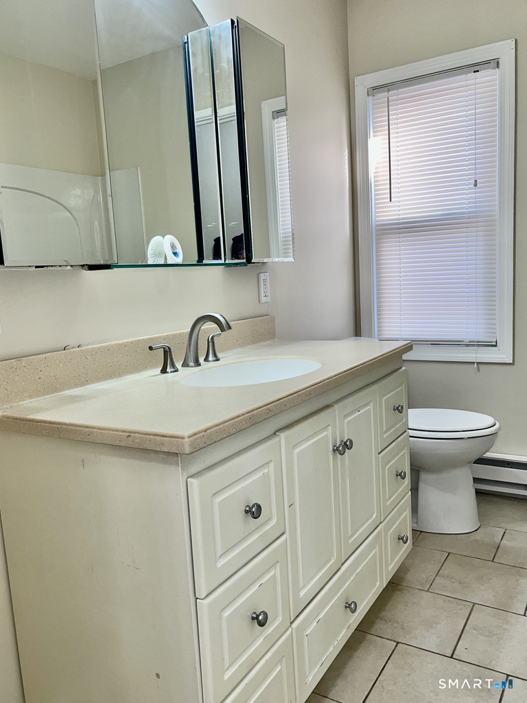 8 Roma Street, Unit 8 East Haven, CT 06512 - Photo 21 of 26 a bathroom with a toilet sink and mirror