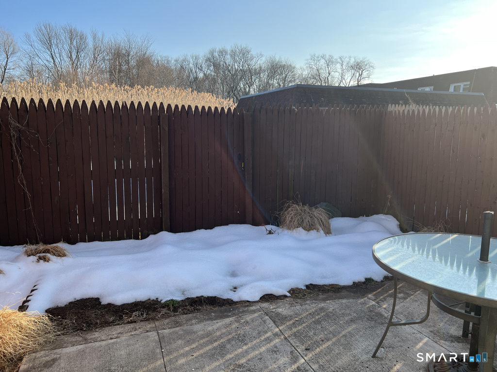 8 Roma Street, Unit 8 East Haven, CT 06512 - Photo 22 of 26 a wooden bench sitting in a backyard