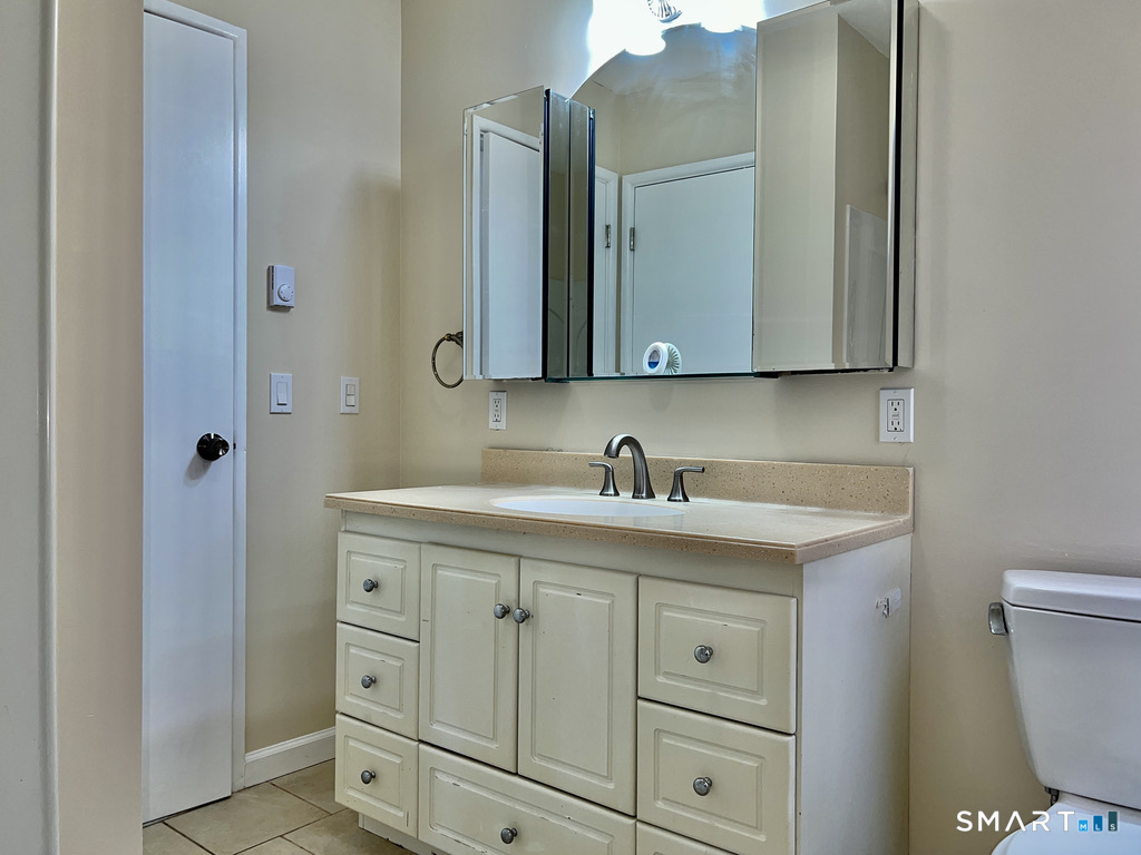8 Roma Street, Unit 8 East Haven, CT 06512 - Photo 24 of 26 a bathroom with a sink and a toilet