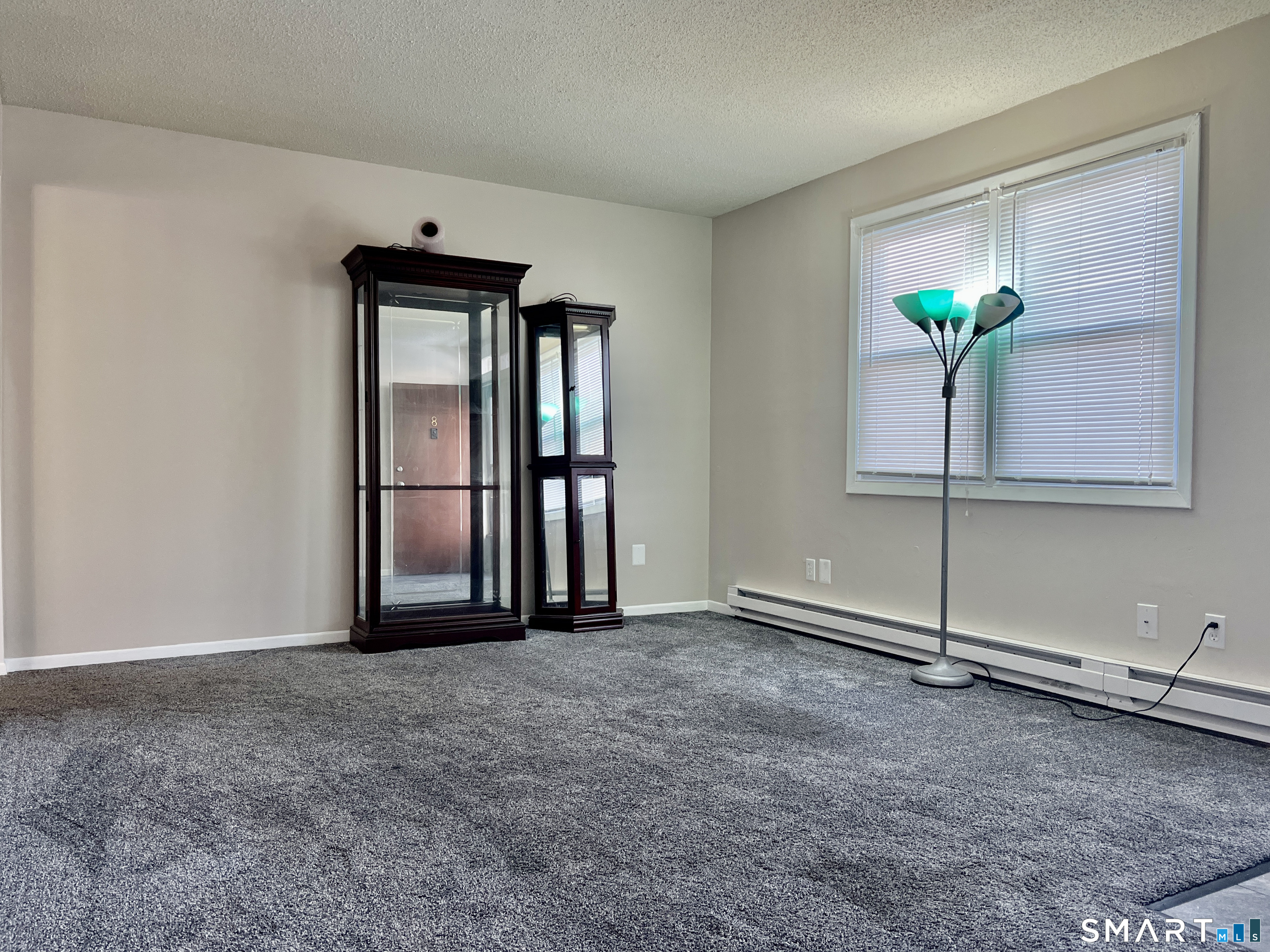 8 Roma Street, Unit 8 East Haven, CT 06512 - Photo 5 of 26 a view of an empty room with window
