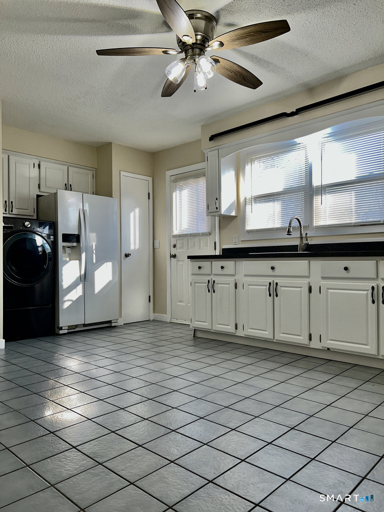 8 Roma Street, Unit 8 East Haven, CT 06512 - Photo 9 of 26 a kitchen with stainless steel appliances granite countertop a sink and a refrigerator