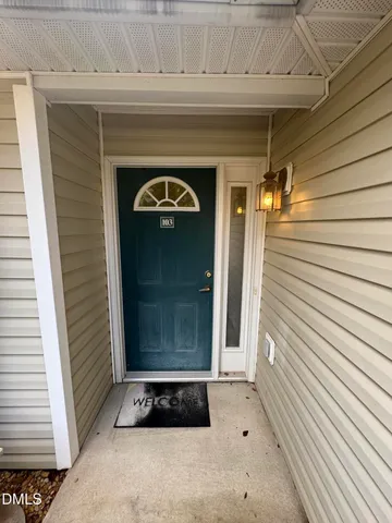 a front view of a house with garage