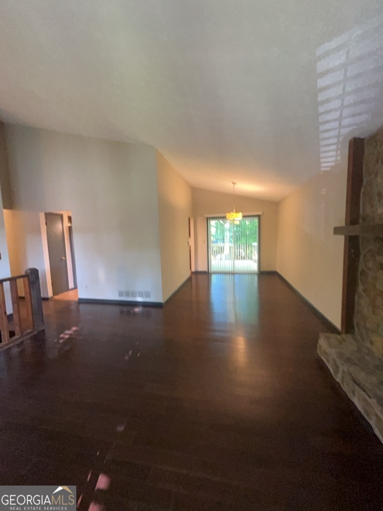 1265 Herrington Road Lawrenceville, GA 30044 - Photo 6 of 52 a view of empty room with wooden floor